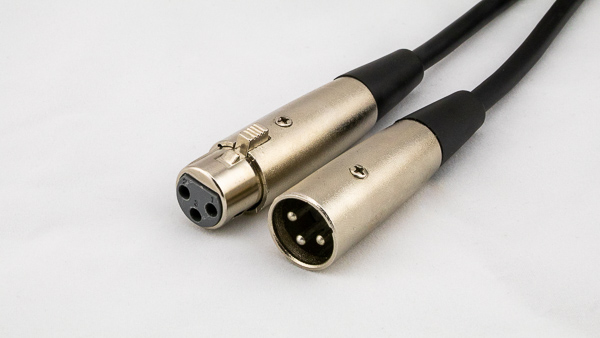 An image of male and female XLR connector attached to a microphone cable.
